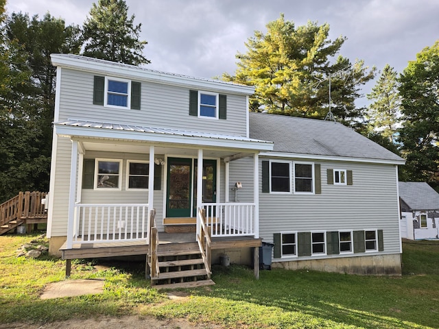 front of property featuring a porch and a front yard