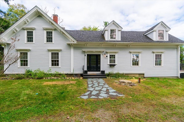 view of front of home featuring a front yard