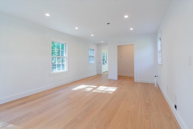 spare room with light hardwood / wood-style floors