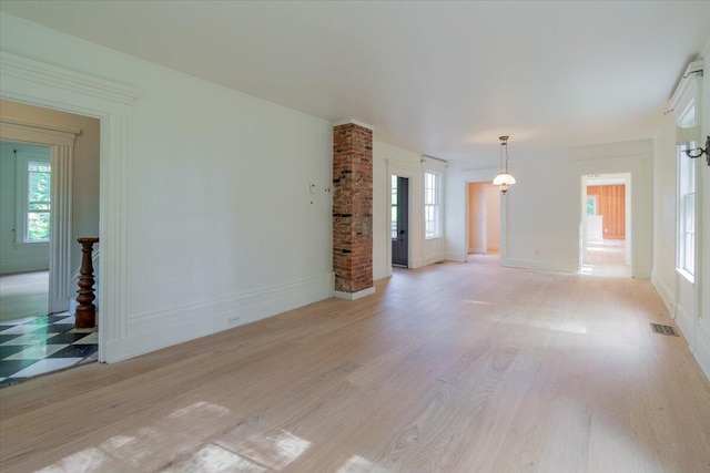 unfurnished living room with light wood-type flooring