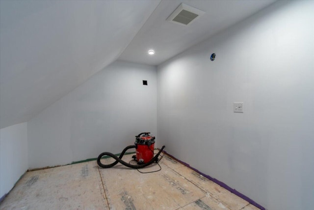 additional living space featuring lofted ceiling