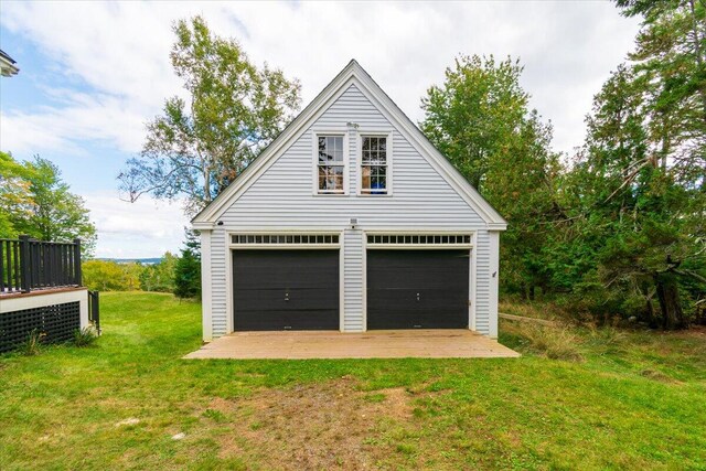 garage featuring a yard