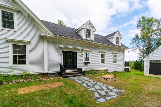 exterior space featuring a lawn, central AC unit, and a garage