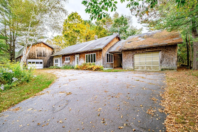 2457 Main St, Hanover, ME 04237 - shingle-style home featuring asphalt driveway, a barn, and a garage