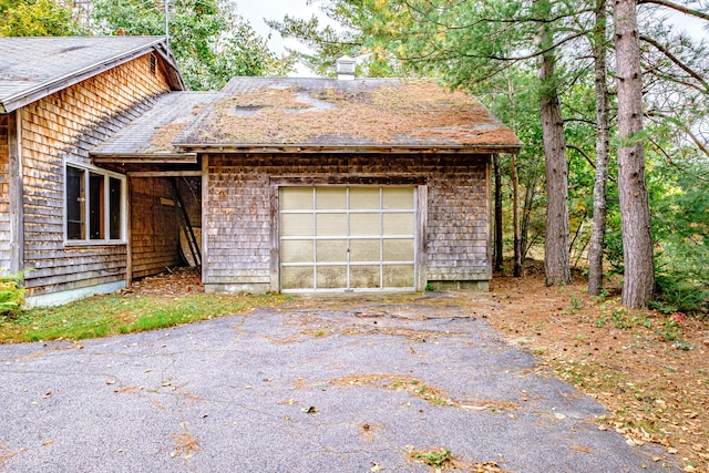2457 Main St, Hanover, ME 04237 - view of home's exterior with driveway and a chimney