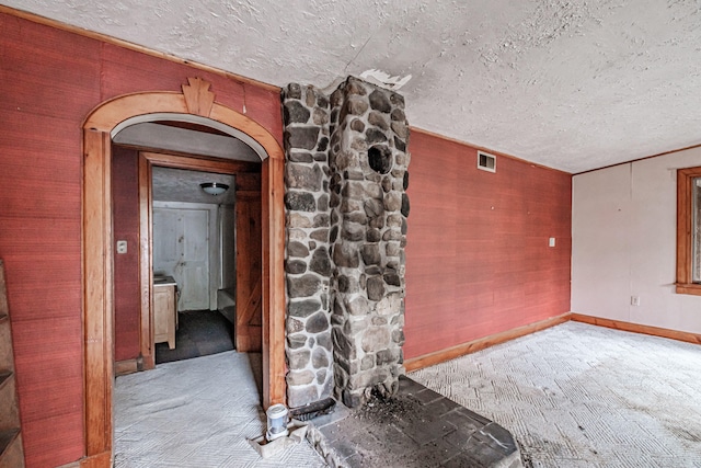 unfurnished room featuring a textured ceiling