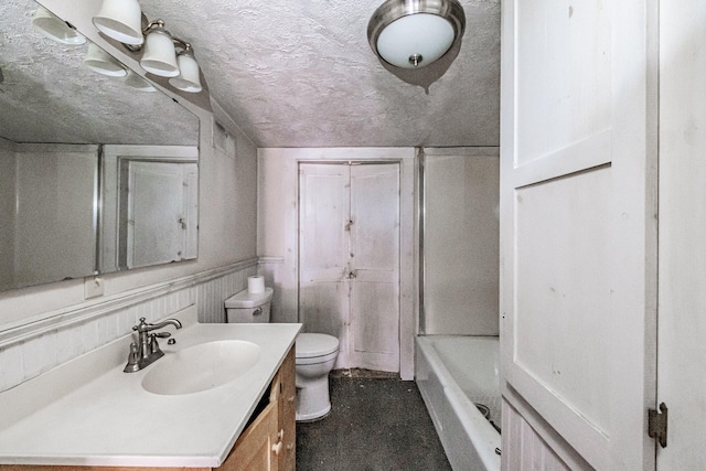 full bathroom with vanity, lofted ceiling, tub / shower combination, a textured ceiling, and toilet