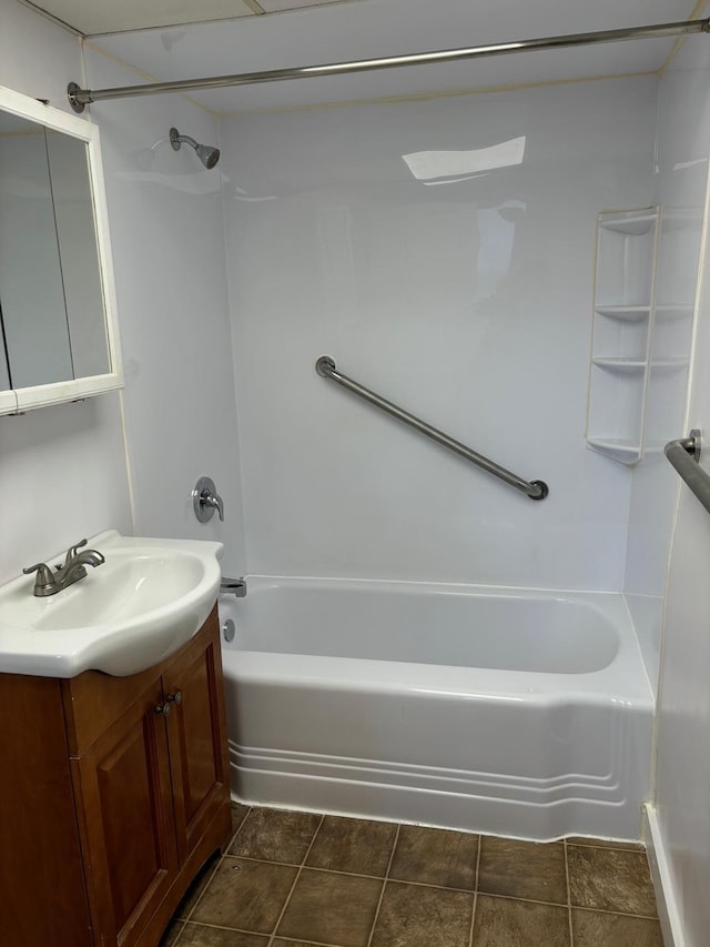 bathroom featuring bathing tub / shower combination and vanity