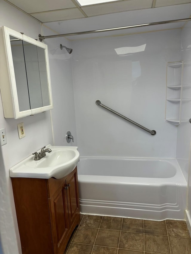 bathroom with vanity, tile patterned floors, and shower / washtub combination