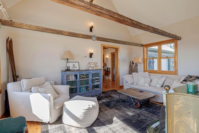 living room featuring hardwood / wood-style flooring and lofted ceiling with beams