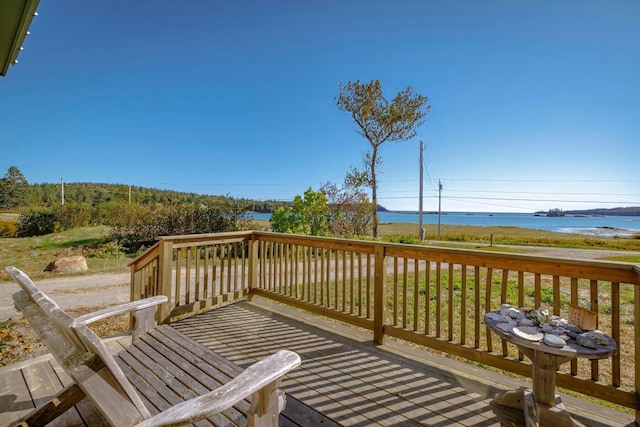 wooden deck featuring a water view