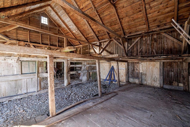 misc room with wood-type flooring, vaulted ceiling with beams, and wood ceiling