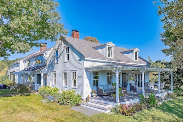 87 Carter Point Rd, Sedgwick, ME 04676 - view of front of property with a front lawn, a chimney, and a shingled roof