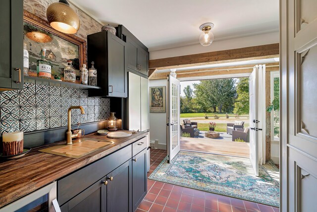 87 Carter Point Rd, Sedgwick, ME 04676 - kitchen with wood counters, a sink, french doors, and dark tile patterned floors