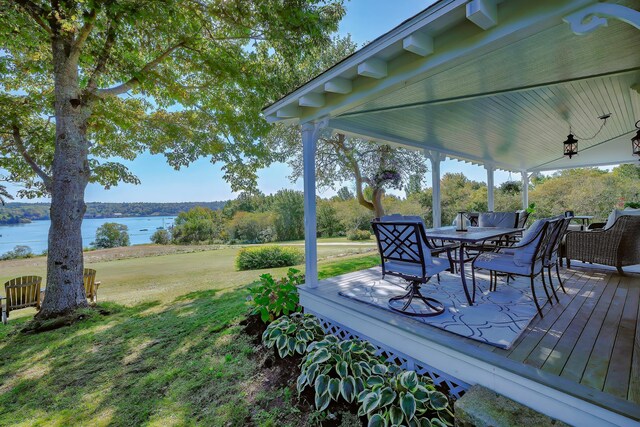 87 Carter Point Rd, Sedgwick, ME 04676 - wooden deck with a water view, outdoor dining space, and a yard