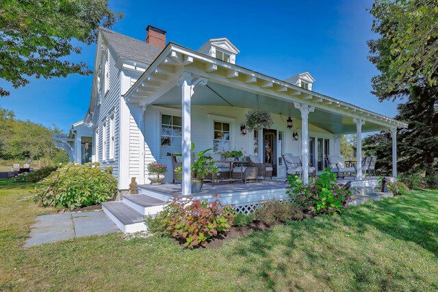 87 Carter Point Rd, Sedgwick, ME 04676 - view of front facade with a front yard and a chimney