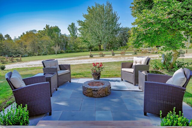 87 Carter Point Rd, Sedgwick, ME 04676 - view of patio featuring an outdoor living space with a fire pit