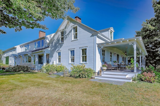 87 Carter Point Rd, Sedgwick, ME 04676 - back of house with a chimney and a yard
