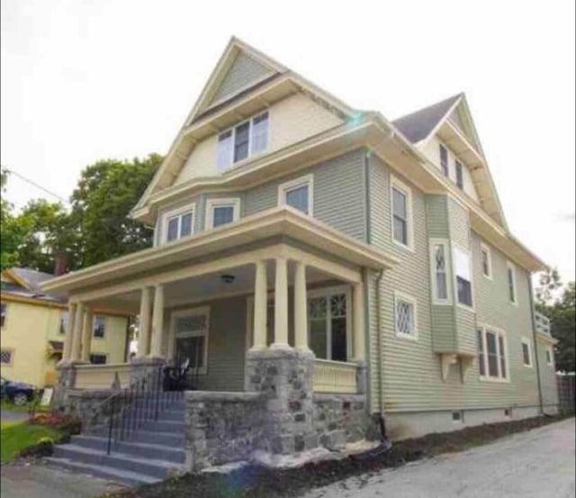 victorian-style house with a porch