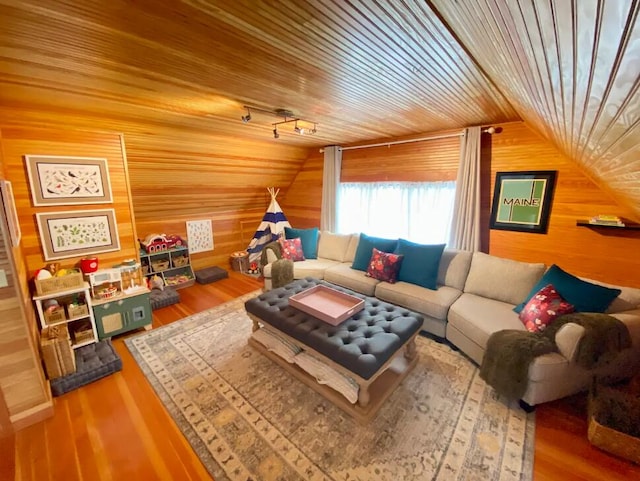 living room with wood-type flooring, wood ceiling, wood walls, and vaulted ceiling