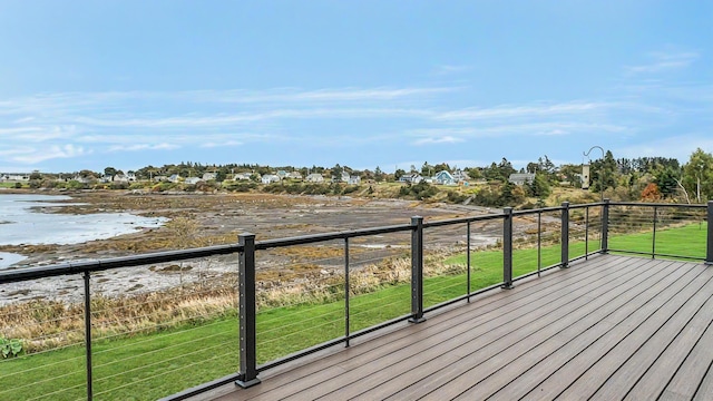 wooden deck featuring a water view