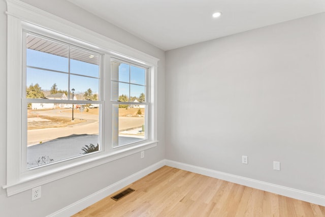 unfurnished room featuring light hardwood / wood-style floors