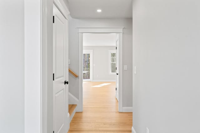 corridor with light wood-type flooring