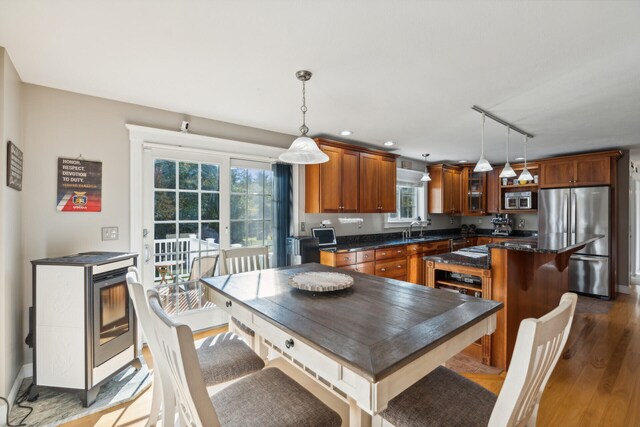 dining room with wine cooler, dark wood-type flooring, and sink