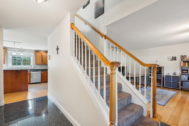 staircase featuring hardwood / wood-style floors