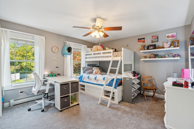 bedroom featuring ceiling fan, carpet floors, and multiple windows