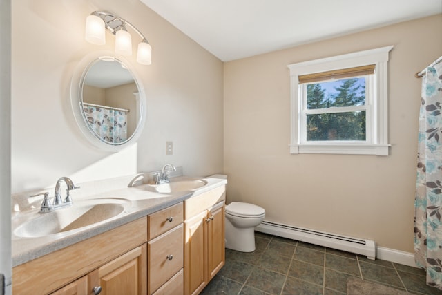 bathroom with vanity, toilet, and a baseboard radiator