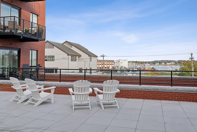 view of patio featuring a balcony