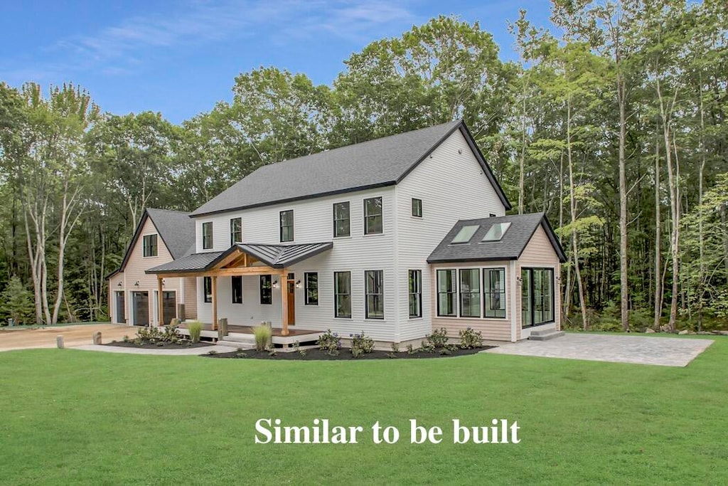 view of front facade with a front yard and a garage