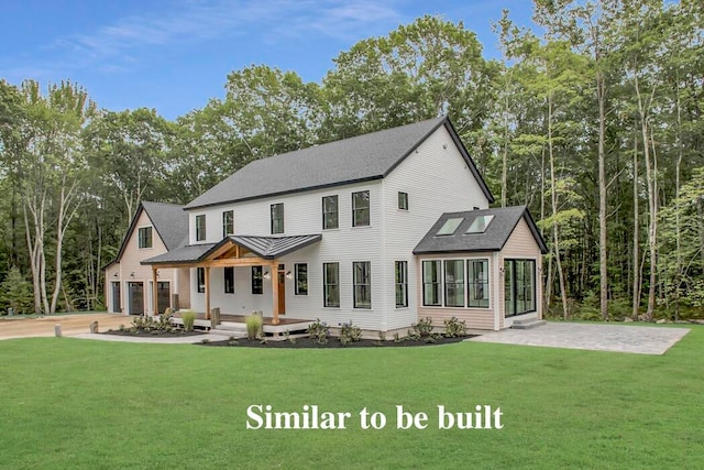 view of front facade with a front yard and a garage