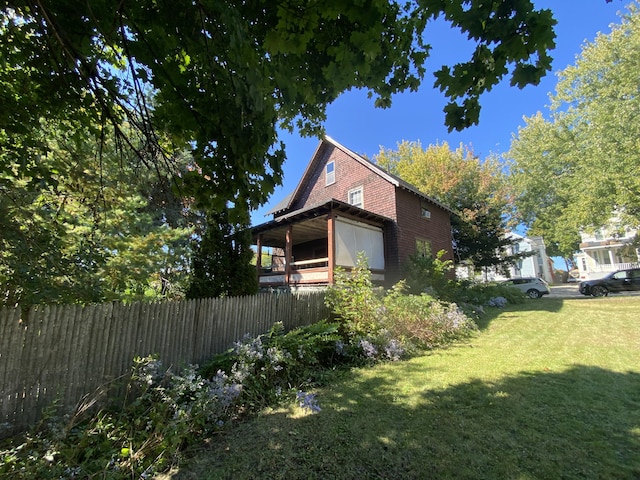 view of home's exterior with a lawn