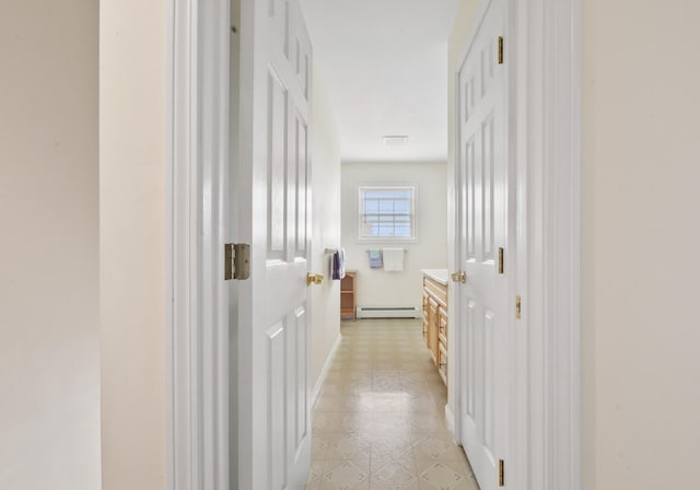 hall featuring a baseboard heating unit