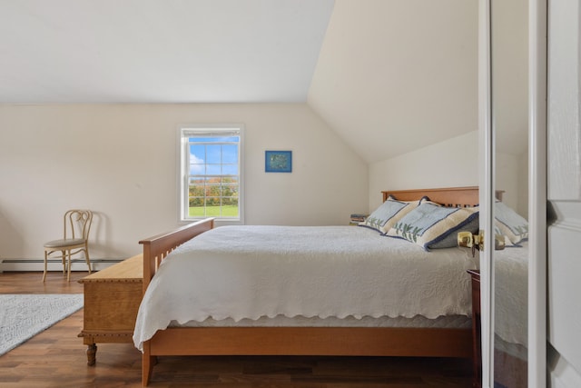 bedroom with wood-type flooring, a baseboard radiator, and vaulted ceiling