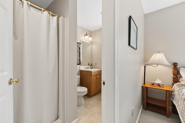 bathroom featuring vanity, toilet, and a shower with curtain