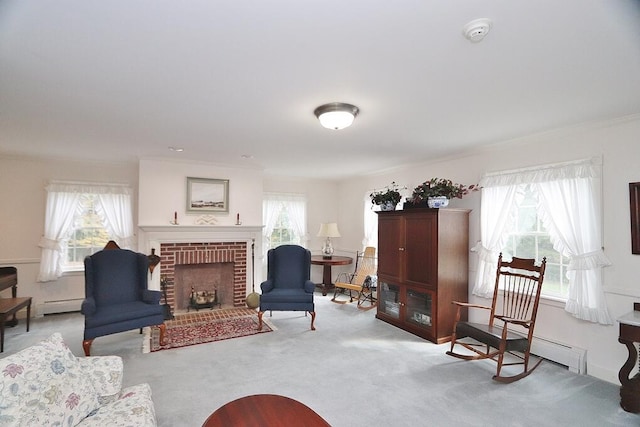 interior space with light carpet, a fireplace, a baseboard heating unit, and plenty of natural light