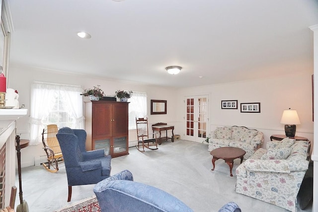 carpeted living room with ornamental molding and a baseboard radiator