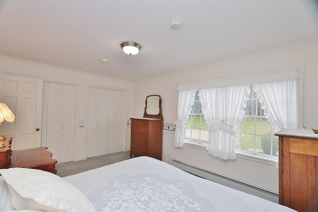 carpeted bedroom featuring a baseboard radiator, ornamental molding, and multiple windows