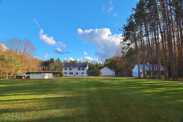 view of yard featuring a swimming pool