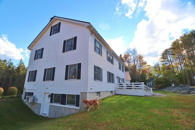 view of home's exterior featuring a lawn