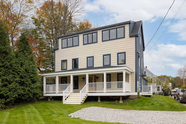 view of front of house with a front lawn and covered porch