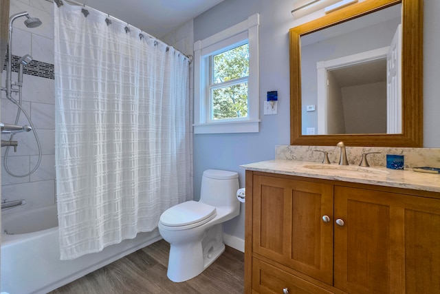 full bathroom featuring vanity, shower / bath combo, hardwood / wood-style floors, and toilet