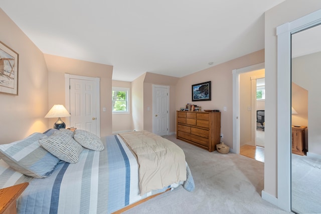 carpeted bedroom with connected bathroom