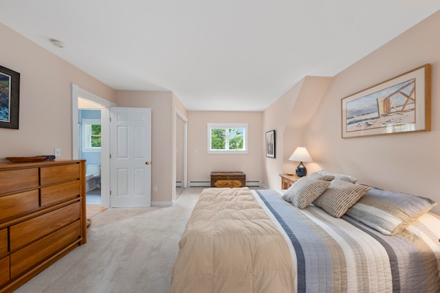 bedroom with baseboard heating and light colored carpet