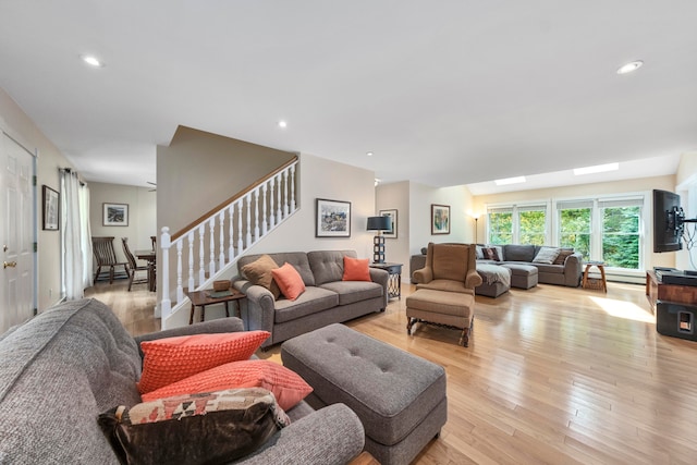 living room with light hardwood / wood-style flooring