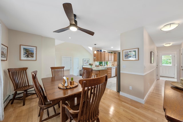 dining space featuring light wood-type flooring and ceiling fan