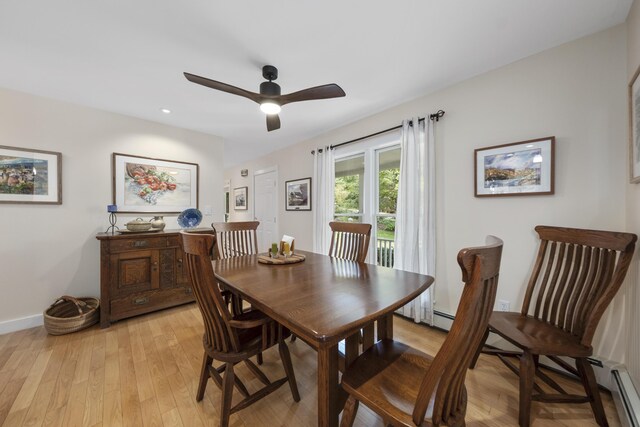 dining space with light hardwood / wood-style floors, baseboard heating, and ceiling fan